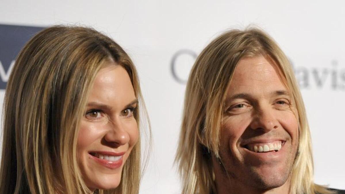 - Foo Fighters drummer Taylor Hawkins, right, and Alison Hawkins
