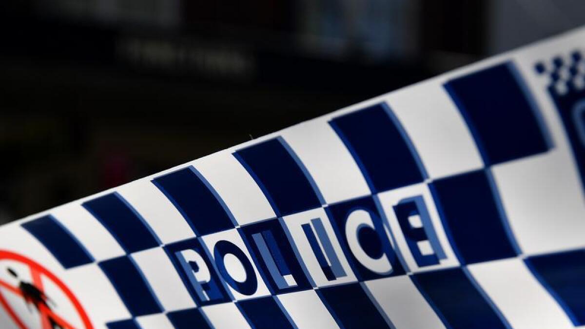 Police tape a crime scene outside Penrith Police Station in Sydney
