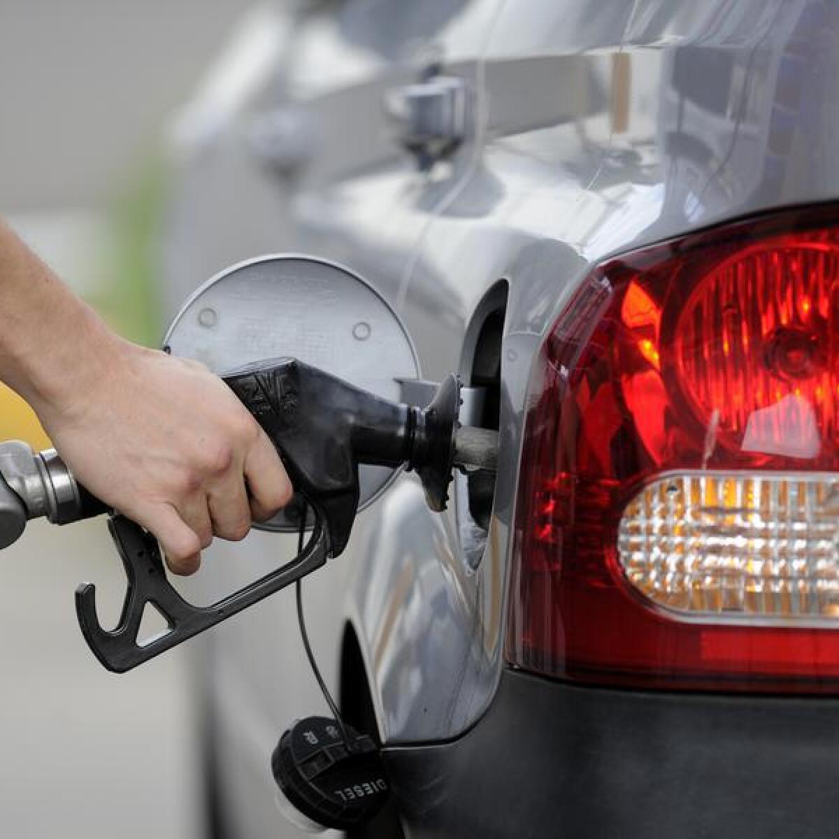 A man pumps petrol at a service station (file image)