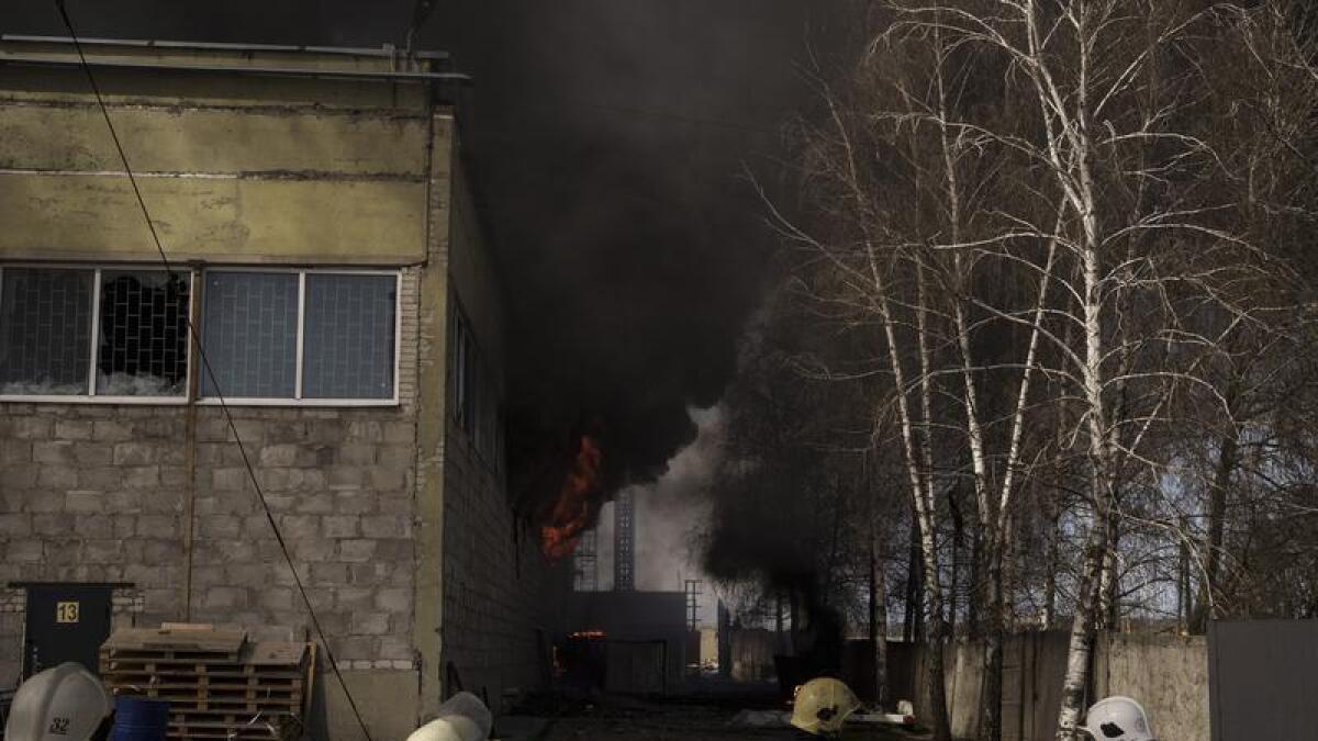 Firefighters after a Russian attack outside Kharkiv, Ukraine.