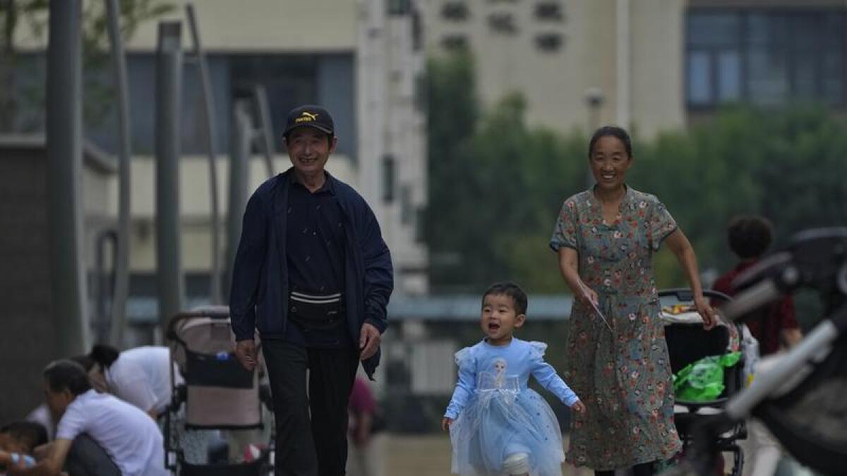 A family walking in the street in China