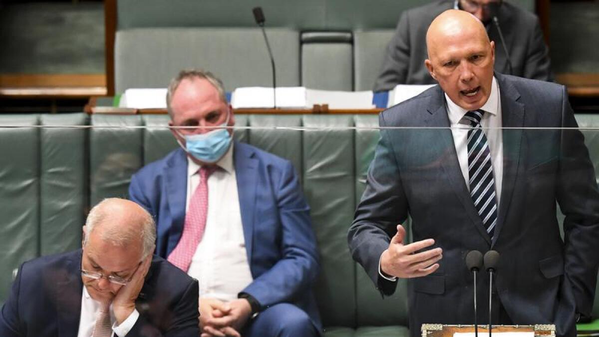 Defence Minister Peter Dutton (right).