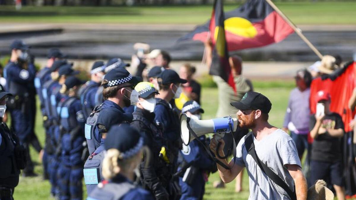 Police and protesters near Old Parliament House.