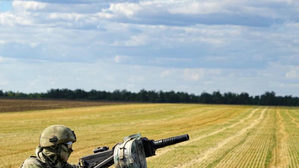 A Russian soldier in a wheat field near Melitopol, south Ukraine