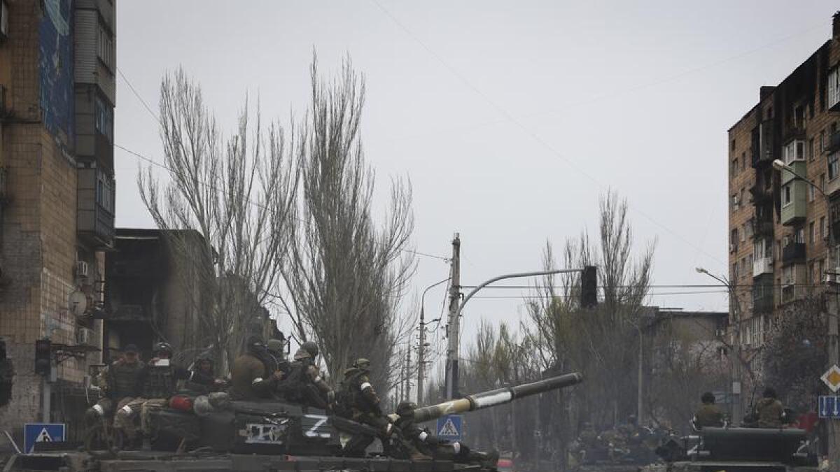 Russian military vehicles move in separatist-controlled Mariupol.