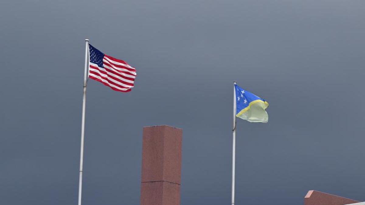 The US flag and the Solomon Islands flag in Honiara.