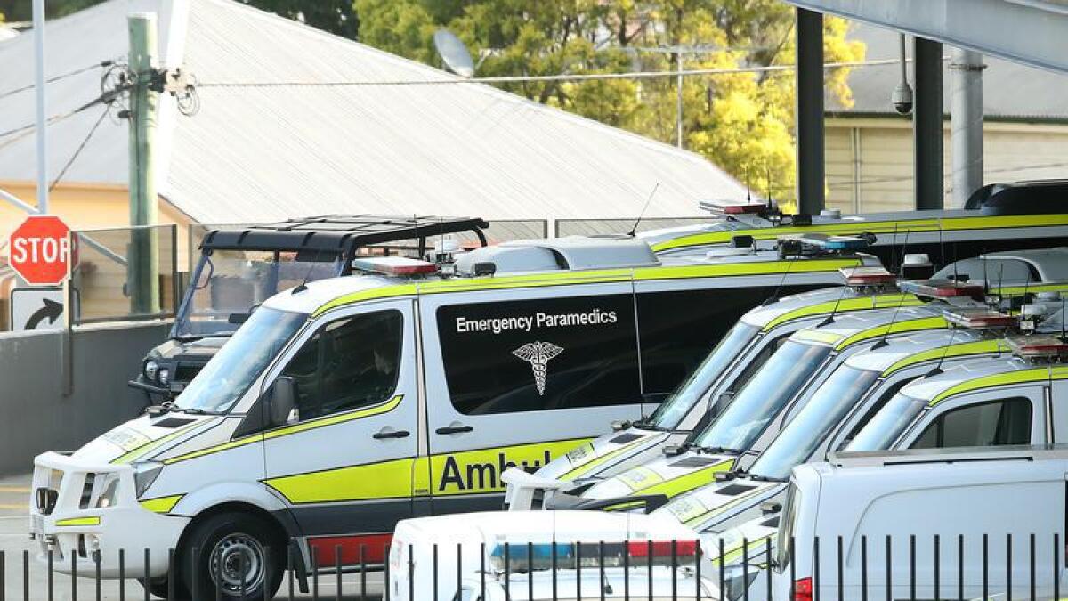 Ambulances queue outside the Princess Alexandra Hospital in Brisbane.
