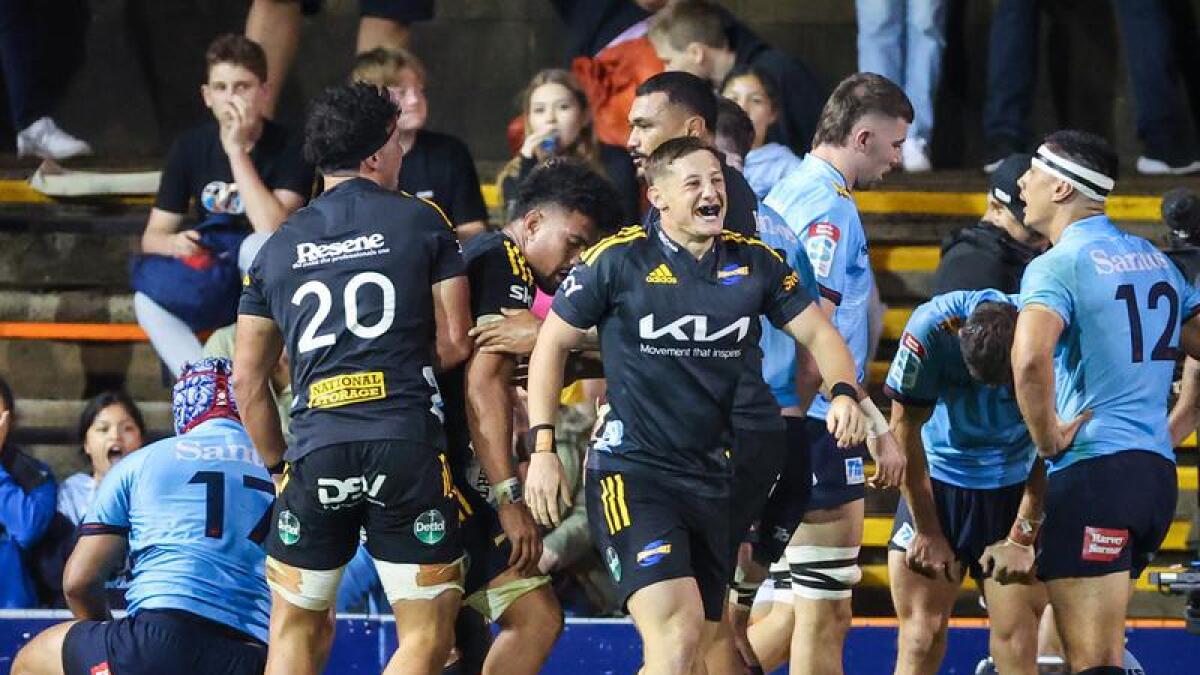 Hurricanes players react after a try.