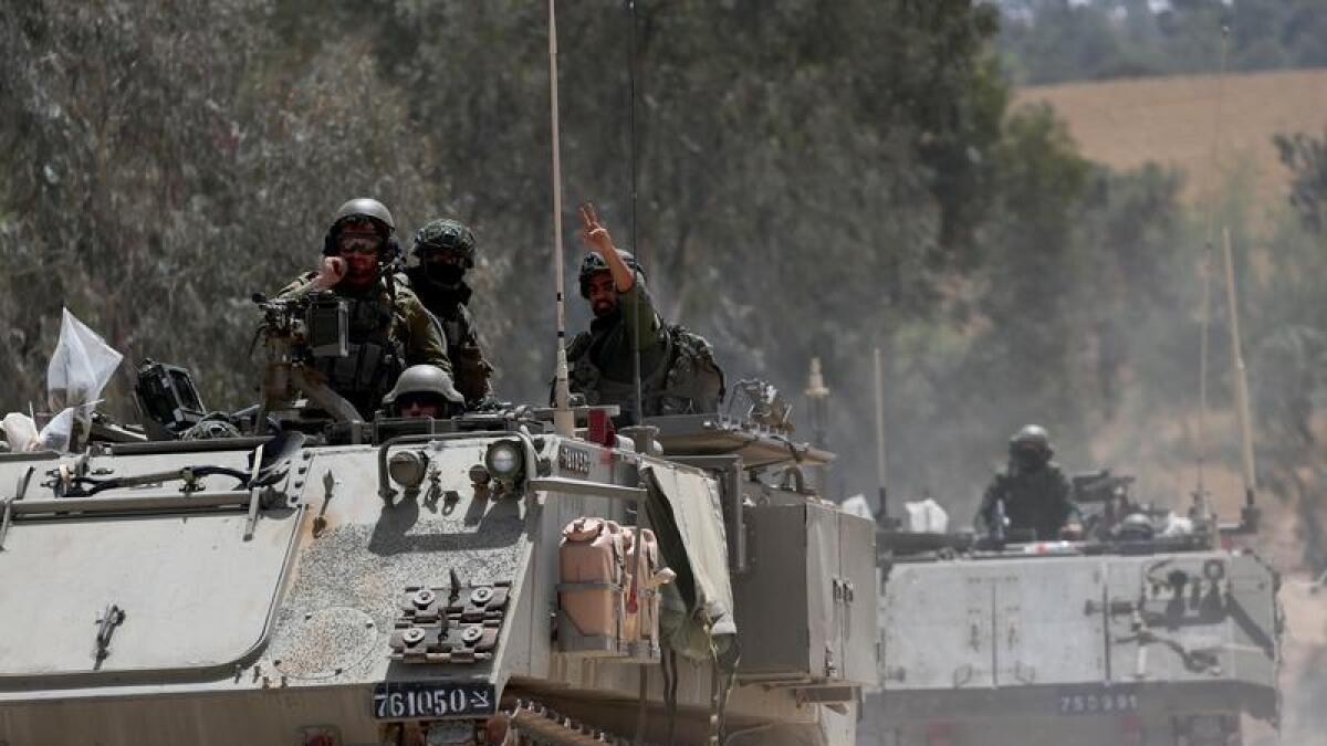 Israeli soldiers on their way to enter the Gaza Strip