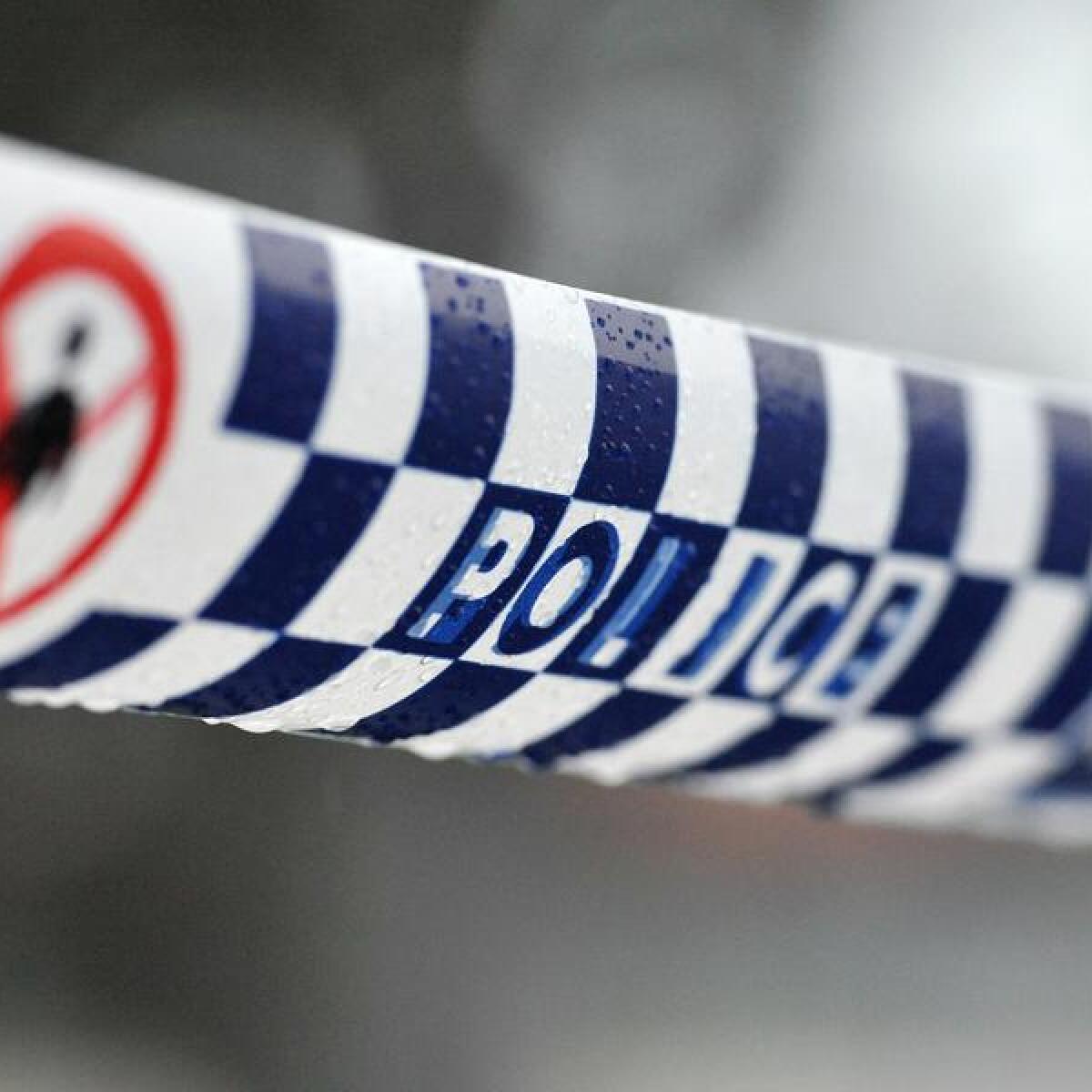 Police tape restricts access to a crime scene north of Sydney