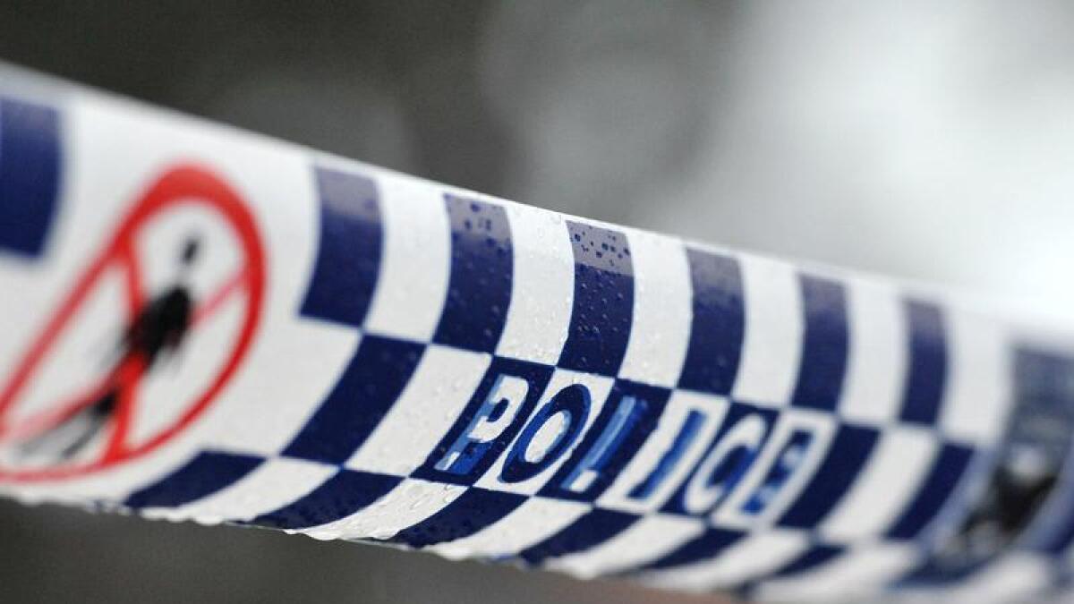 Police tape restricts access to a crime scene north of Sydney