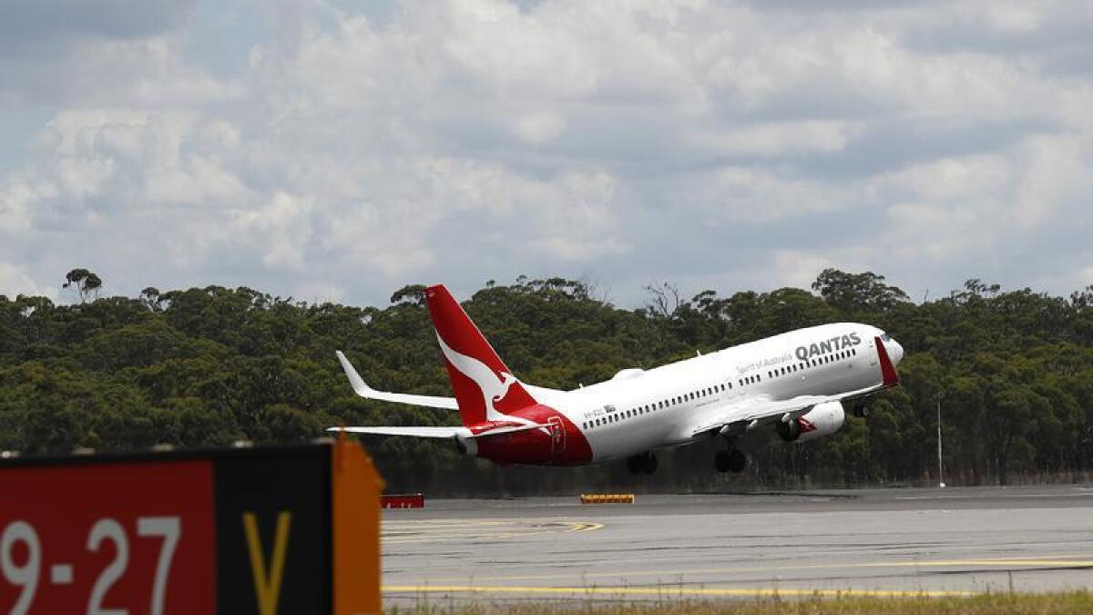 A Qantas plane takes off