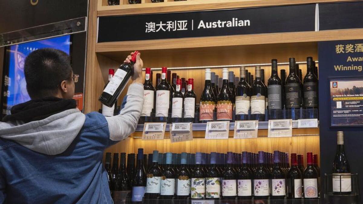 A man shops for Australian wine in Shanghai, China
