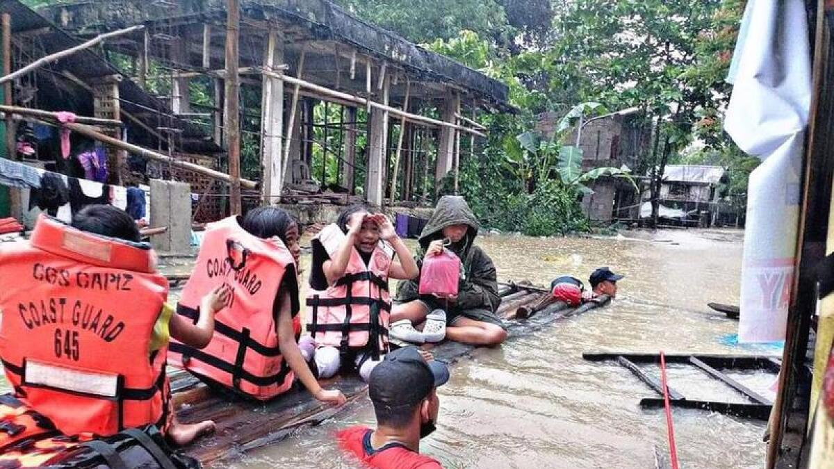 Flooding and landslides have killed more than 150 in the Philippines.