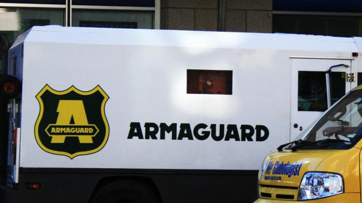 An Armaguard truck travels through Sydney.