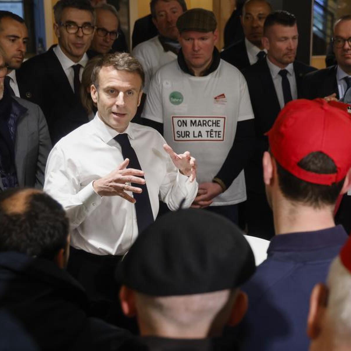 French President Emmanuel Macron in a discussion with farmers