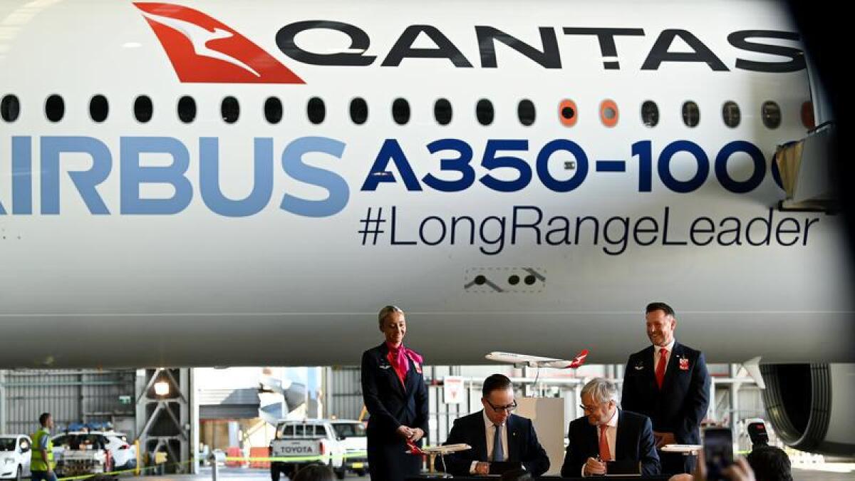 Qantas' Alan Joyce (middle L), Airbus' Christian Scherer (middle R).