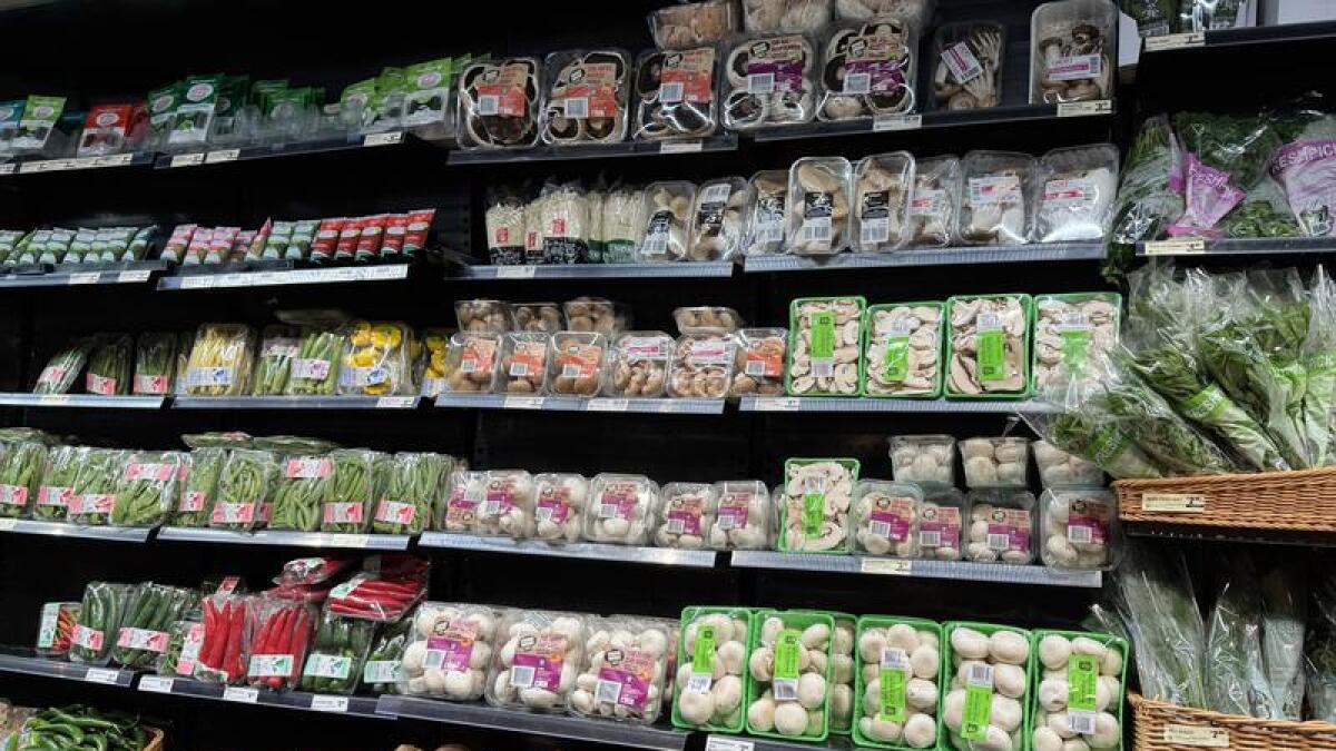 Vegetables and mushrooms are seen at a supermarket