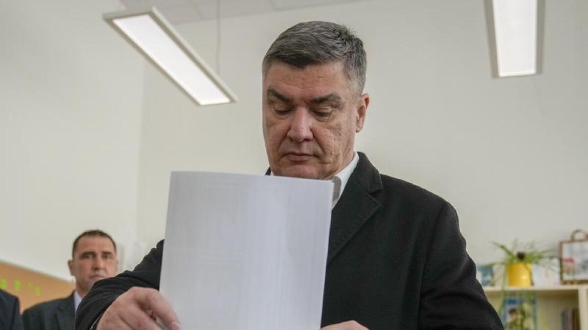 Croatia's President Zoran Milanovic casts his ballot in Zagreb