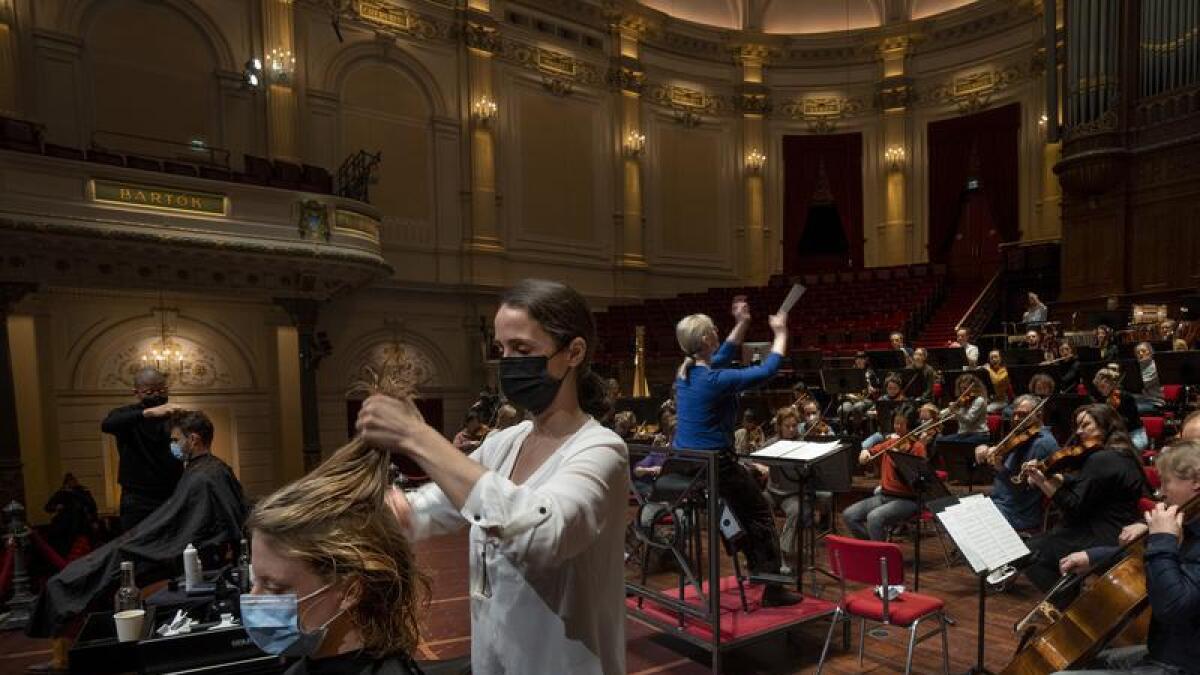 People get a haircut at the Concertgebouw in Amsterdam