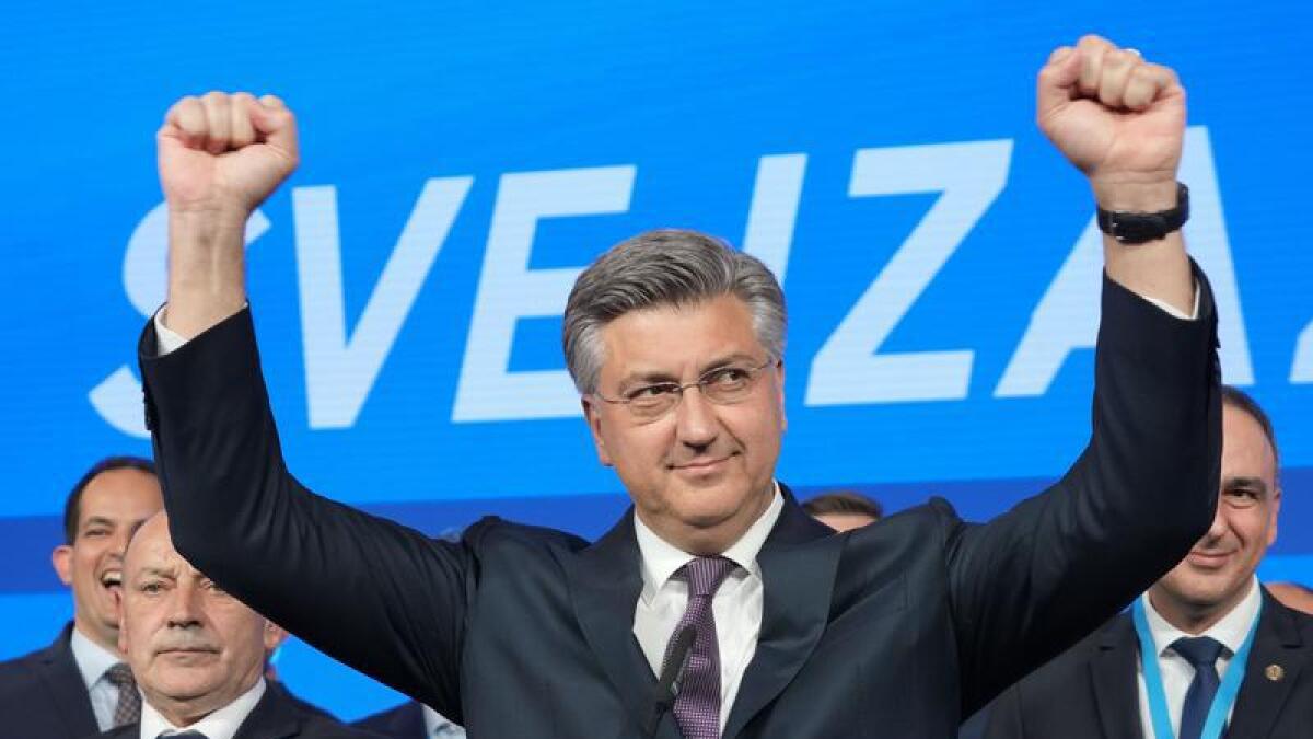 Prime Minister Andrej Plenkovic celebrates the parliamentary election