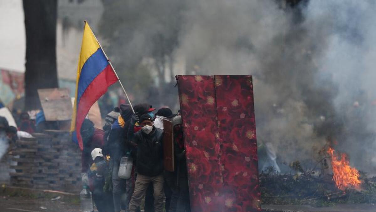 Demonstrators clash with riot police in Ecuador's capital Quito.