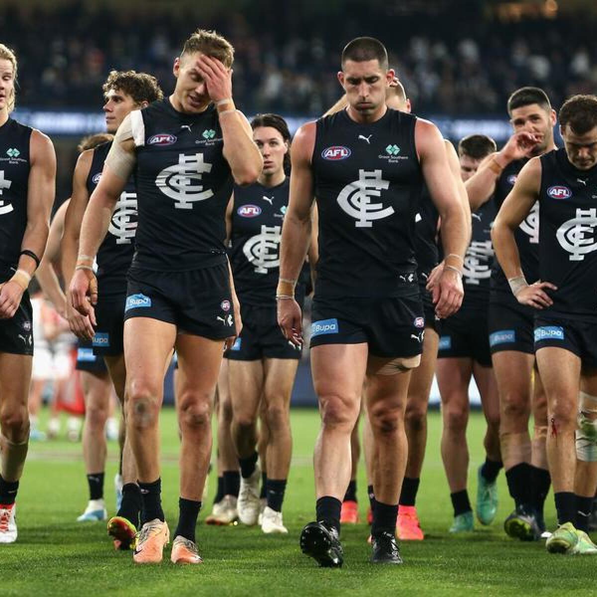 Disappointed Carlton players.