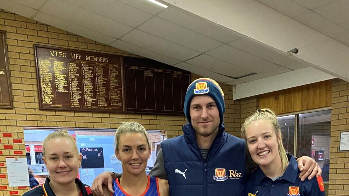 Socking it to cancer: Violet Town football and netball players Prue Holmes, Jayde Burden, Ryan Jennings and Kolby Wild.