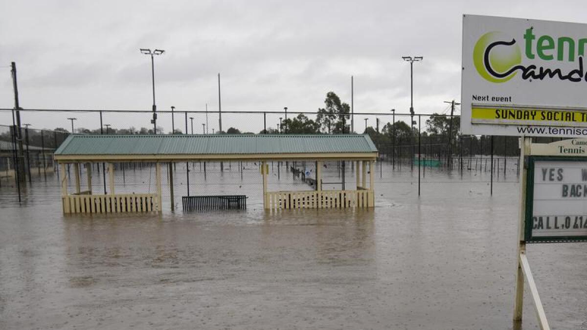 Flooded tennis courts in Camden