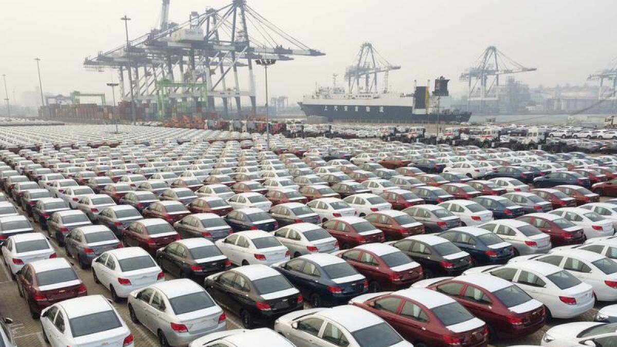 New cars wait to be exported from a port in China.