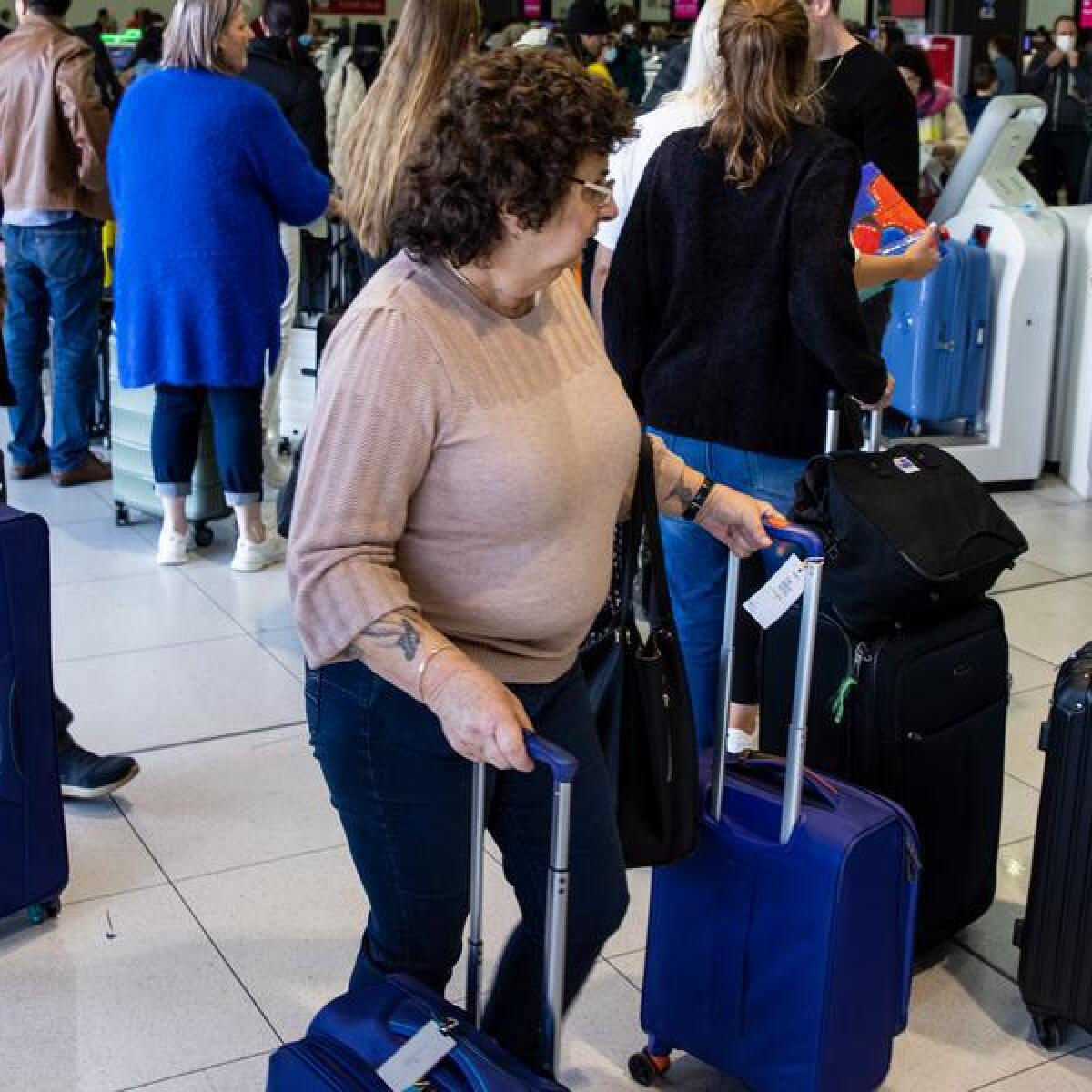 Travellers queue at Melbourne airport