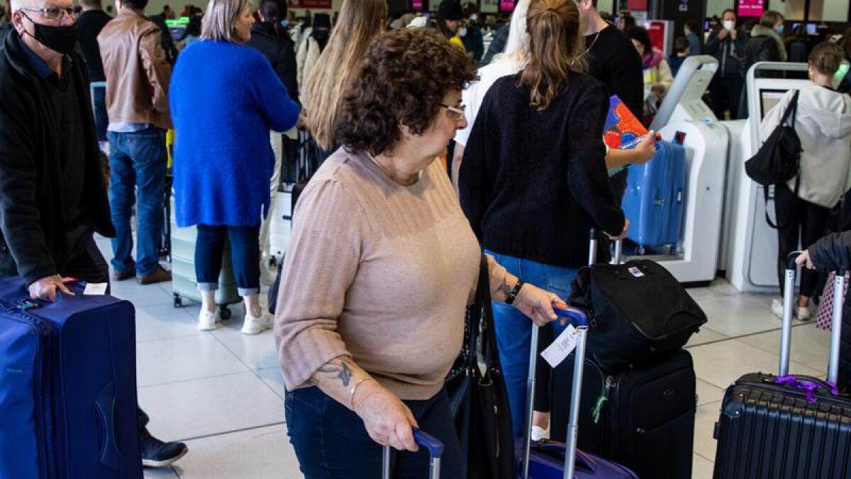 Travellers queue at Melbourne airport