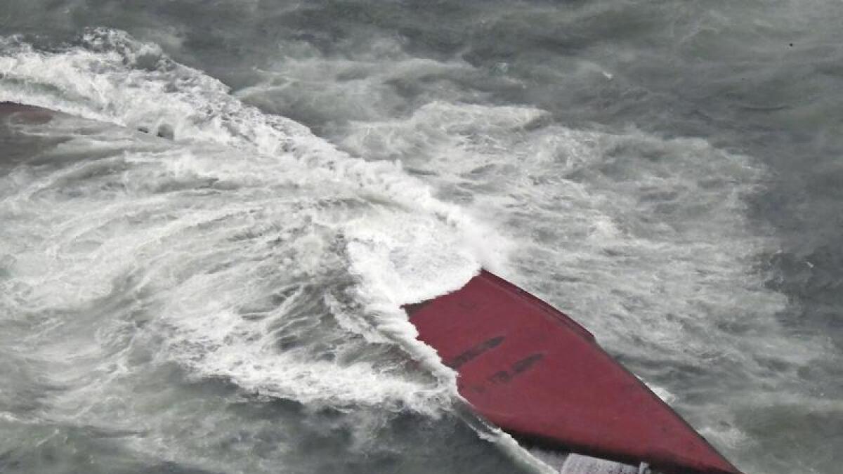 A South Korean tanker is seen capsized off Mutsure Island, Japan