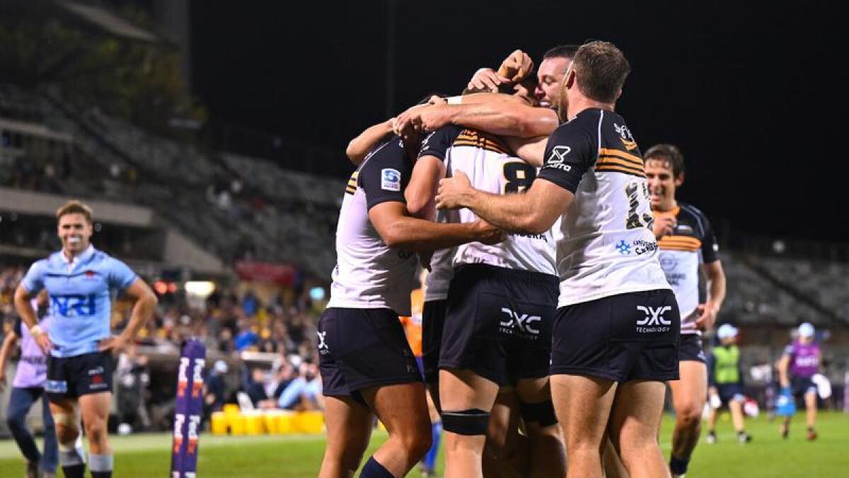 ACT Brumbies players celebrate. 