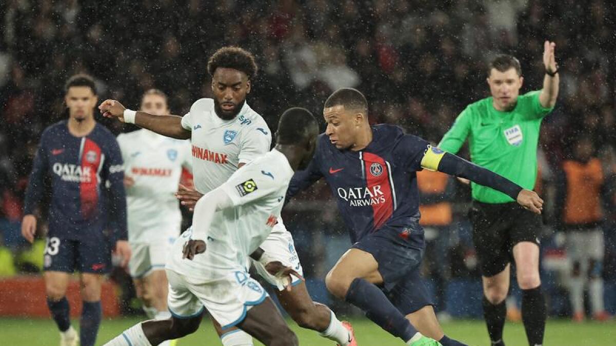 Kylian Mbappe runs at the Le Havre defence.