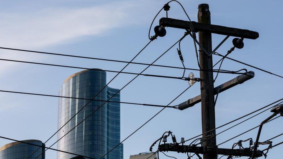 Electricity poles and wires are seen in Melbourne.