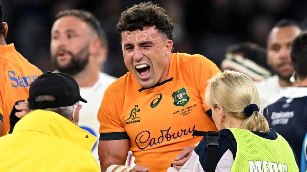 Tom Banks receives medical attention in the Wallabies-England Test.