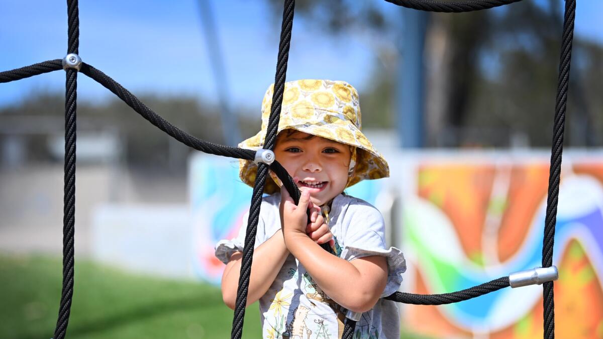 Say cheese: Maya Vidler, 4 climbing on the playground.