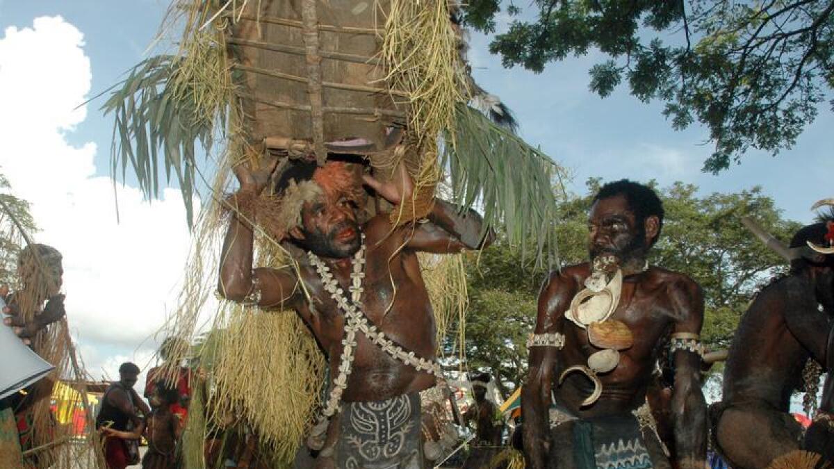 Dancers welcome the late Michael Somare in Wewak (file image)