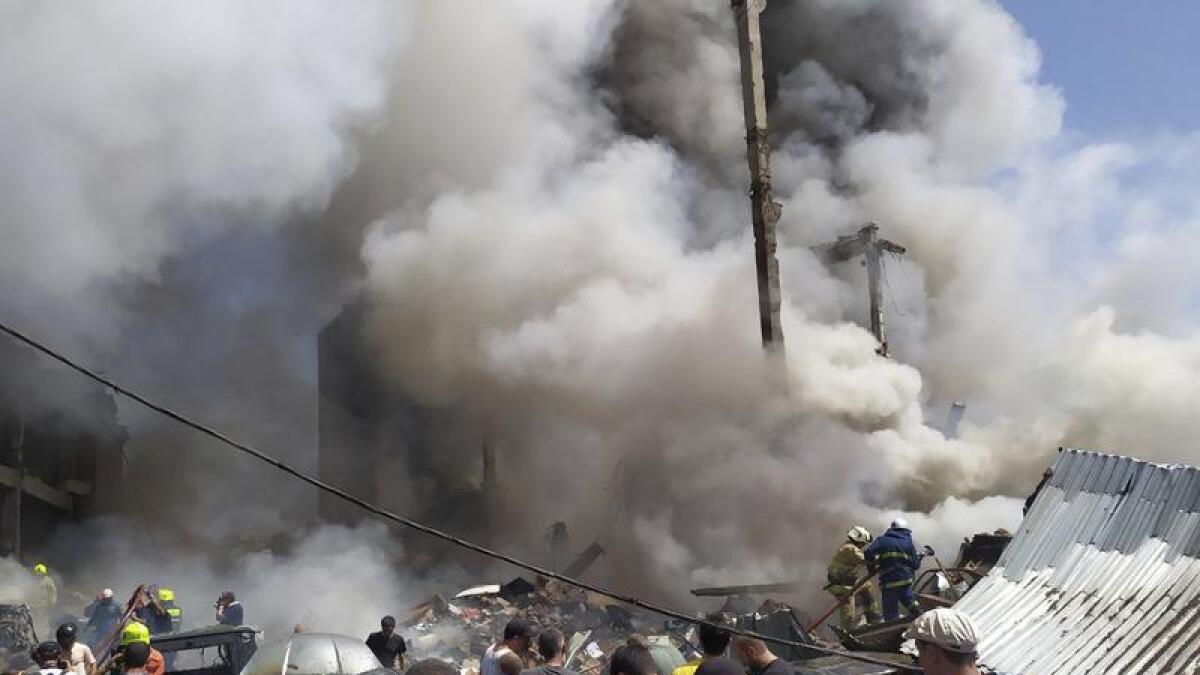 Smoke rises from Surmalu market in Yerevan, Armenia