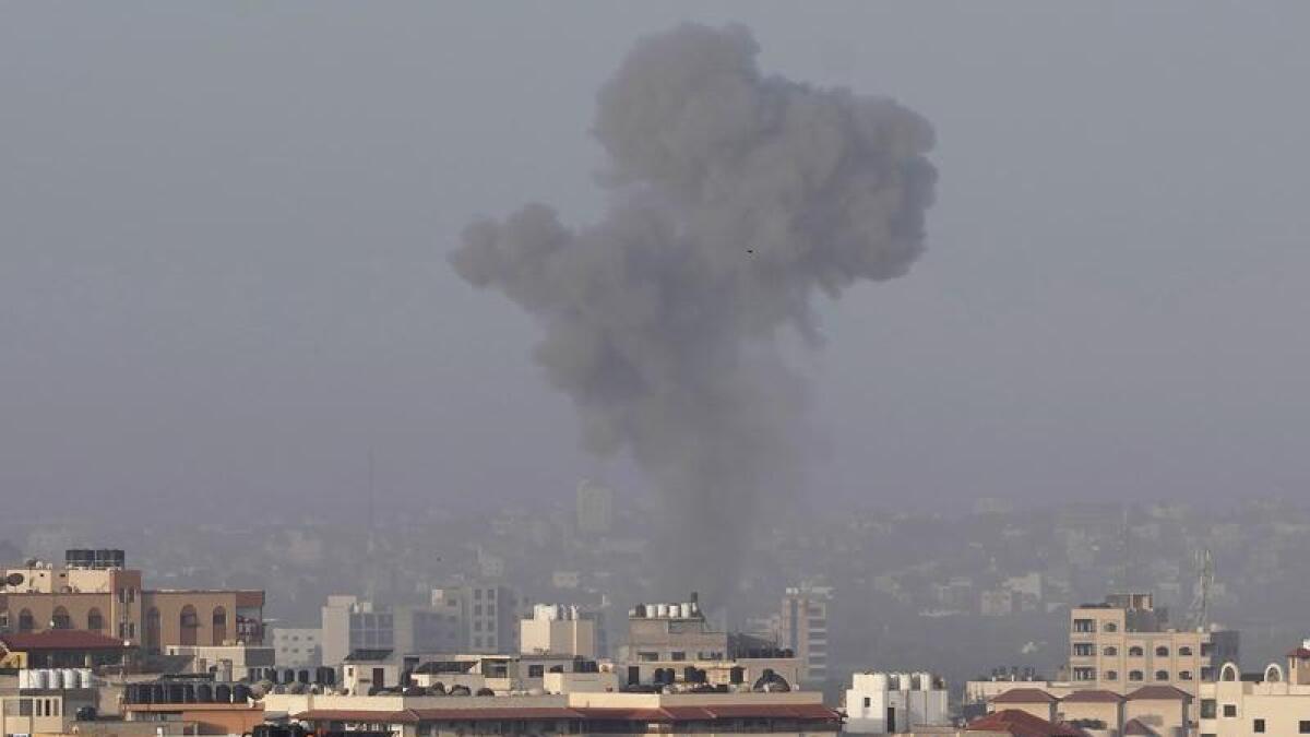 Smoke rises after Israeli airstrikes on a Hamas military camp