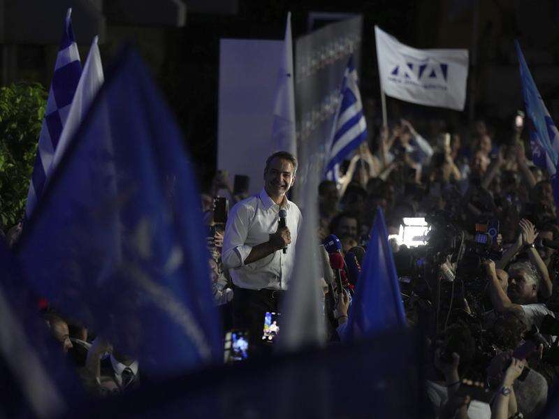 Greek conservatives storm to victory in repeat election