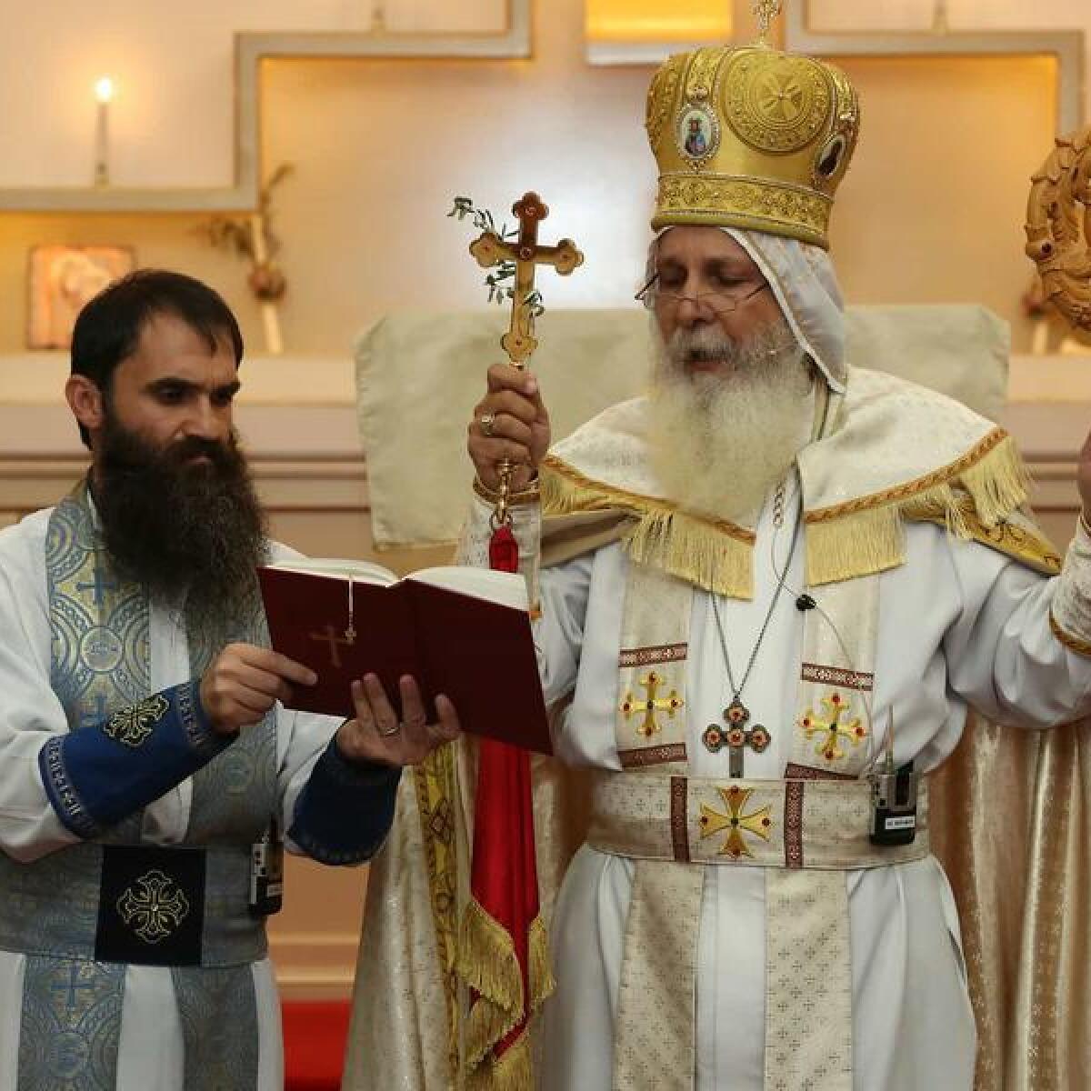 Bishop Mar Mari Emmanuel (right)