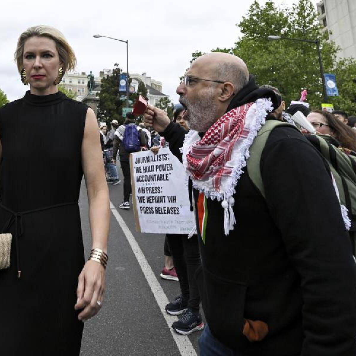 A women confronted by a demonstrator