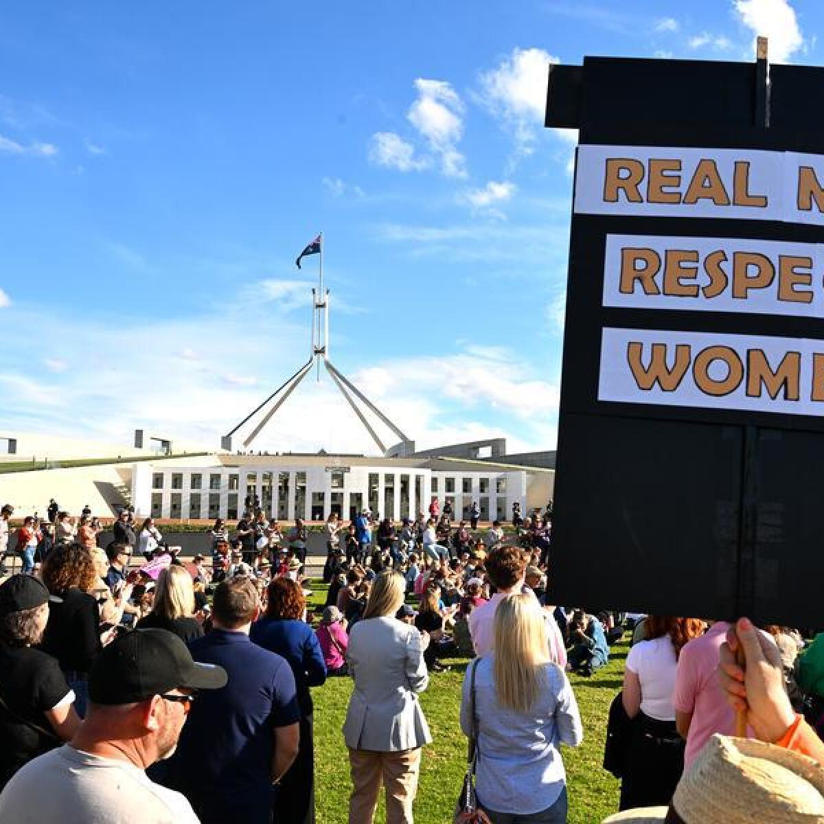 People at a rally in front of Parliament House.